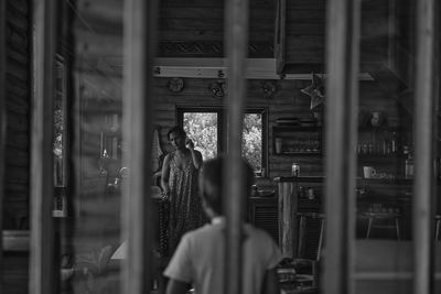 People standing in glass window