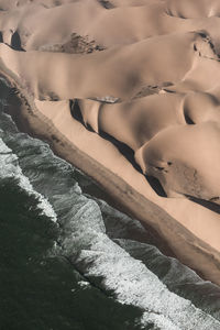 High angle view of woman lying on bed