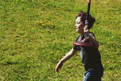 Full length of girl standing on grassy field