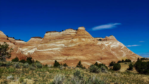 Low angle view of rock formations against sky