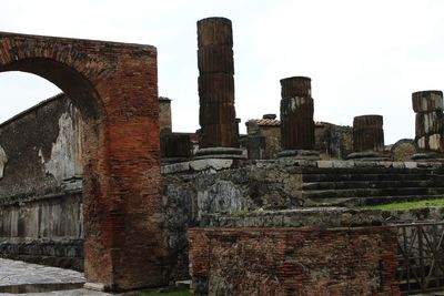 Low angle view of old ruin against sky