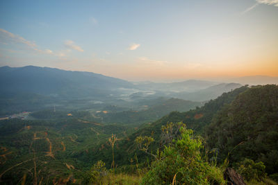 Scenic view of mountains against sky during sunset