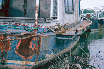 Abandoned boat moored in water