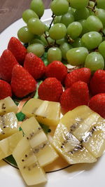 Close-up of chopped fruits in bowl on table