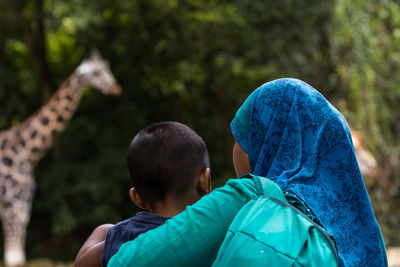 Rear view of two boys outdoors