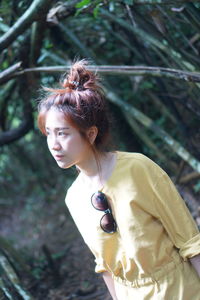 Portrait of smiling young woman standing outdoors