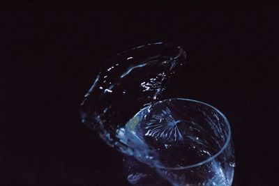 Close-up of glass against black background