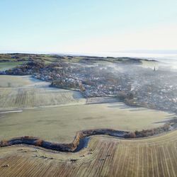 High angle view of land against clear sky