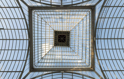 Low angle view of skylight in crystal palace of retiro park of madrid, spain.