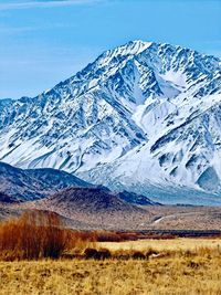 Scenic view of snowcapped mountains against sky