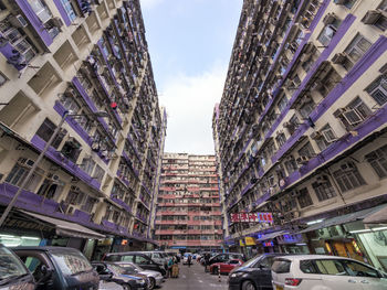 Low angle view of buildings in city against sky