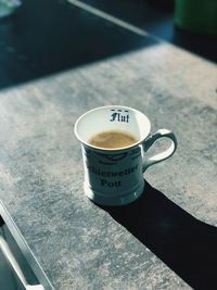 High angle view of coffee cup on table