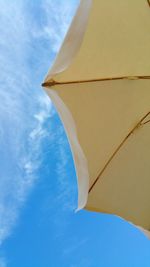 Low angle view of parasol against sky