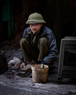 Portrait of man sitting in yard