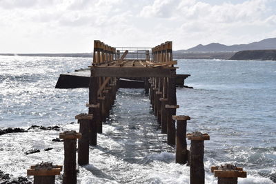 Pier over sea against sky