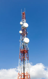 Low angle view of communications tower against sky