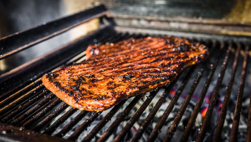 High angle view of meat on barbecue grill