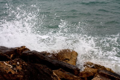 Waves splashing on rocks