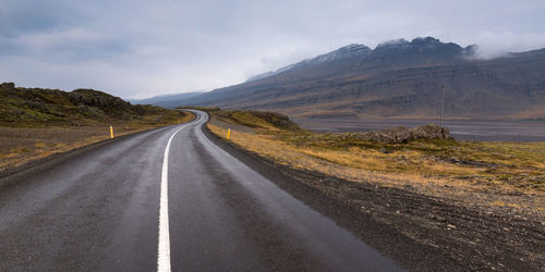 Country road leading towards mountains