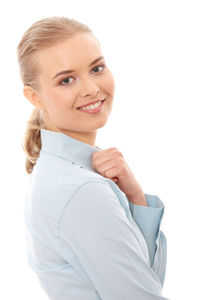 Portrait of a smiling teenage girl over white background