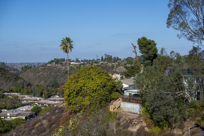 High angle view of trees and buildings against sky