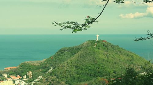 Scenic view of sea against cloudy sky