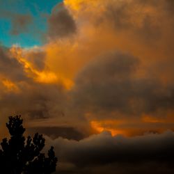 Low angle view of cloudy sky during sunset