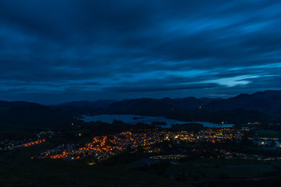 High angle view of illuminated buildings in city at night