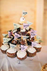 High angle view of cupcakes with labels on table