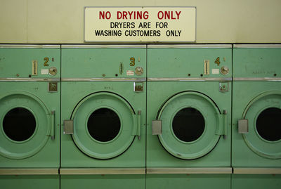 Full frame shot of dryers with text