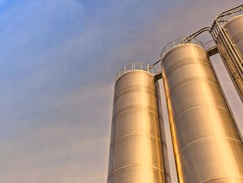 Low angle view of smoke stack against sky