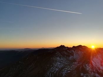 Scenic view of mountains against sky during sunset