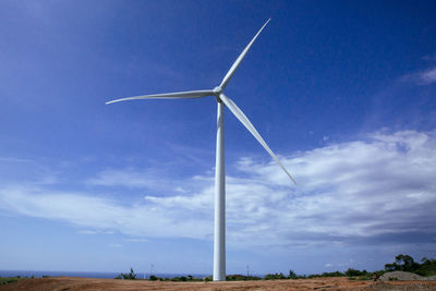 Wind turbine against sky