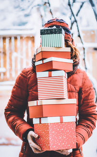 Full length of man holding stack