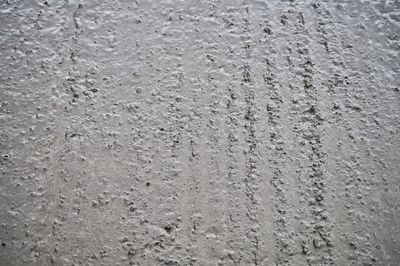 Full frame shot of water drops on concrete wall