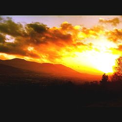 Scenic view of landscape against sky during sunset