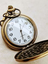 Close-up of clock on table