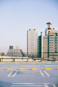 Road with buildings in background