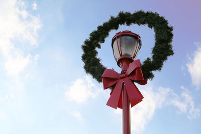 Low angle view of street light against sky