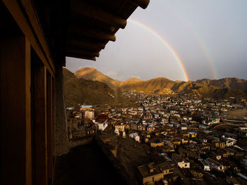 Aerial view of rainbow over town