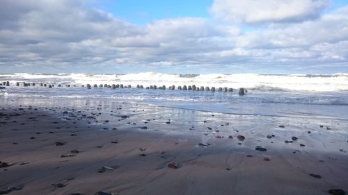 Scenic view of beach against sky