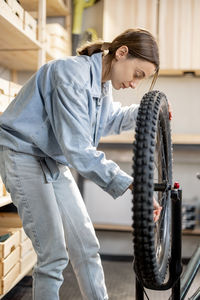 Side view of woman working