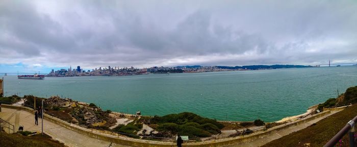 Panoramic view of sea and city against sky