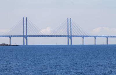 View of suspension bridge over sea