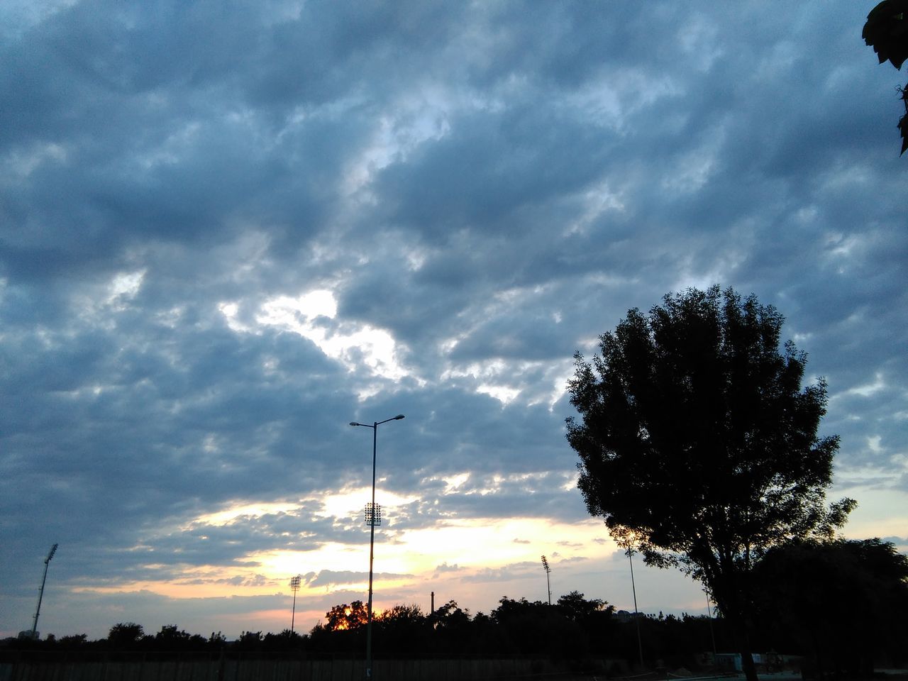 cloud - sky, sky, no people, low angle view, silhouette, tree, sunset, nature, technology, dramatic sky, outdoors, beauty in nature, day