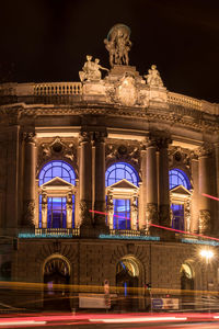 Low angle view of illuminated building at night