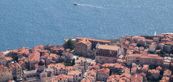 High angle view of townscape by sea