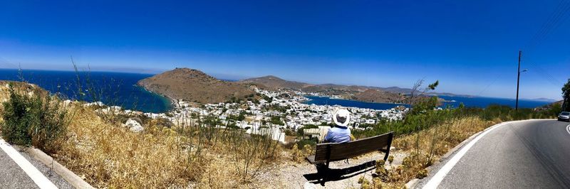 Panoramic view of city against clear blue sky