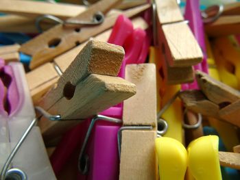 Close up of wooden and coloured clothes pegs