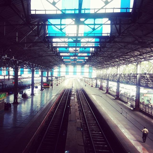 railroad track, transportation, railroad station platform, rail transportation, built structure, public transportation, railroad station, architecture, the way forward, indoors, diminishing perspective, vanishing point, incidental people, ceiling, building exterior, travel, city life, city, mode of transport, railway track